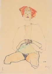 Semidesnudo sentado con cabello rojo